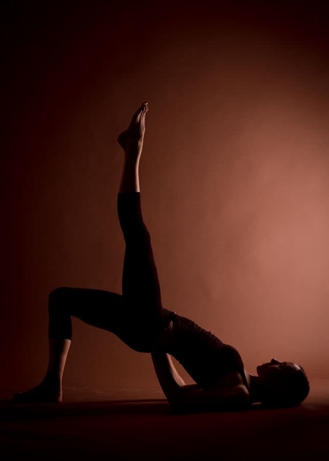 Three women moving through a seated stretch